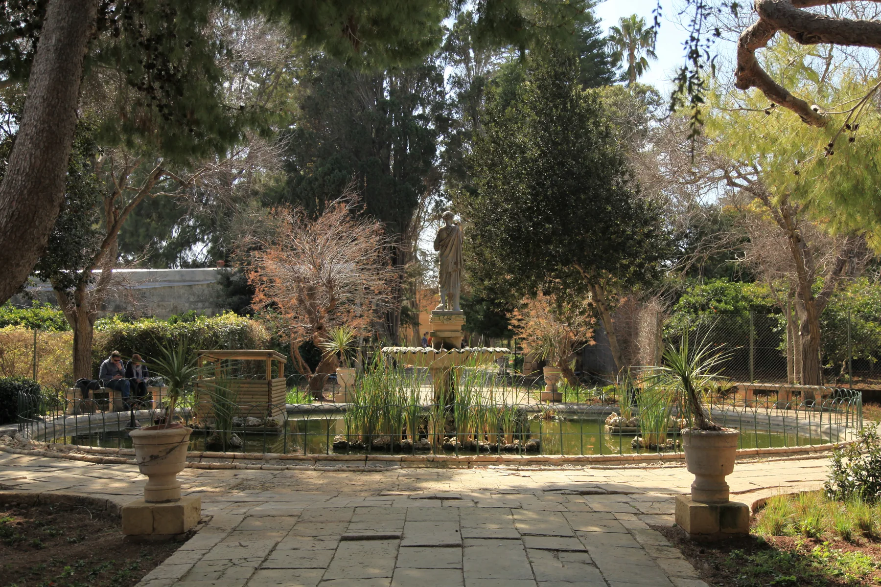 Pond, statue and trees in San Anton Gardens, Attard