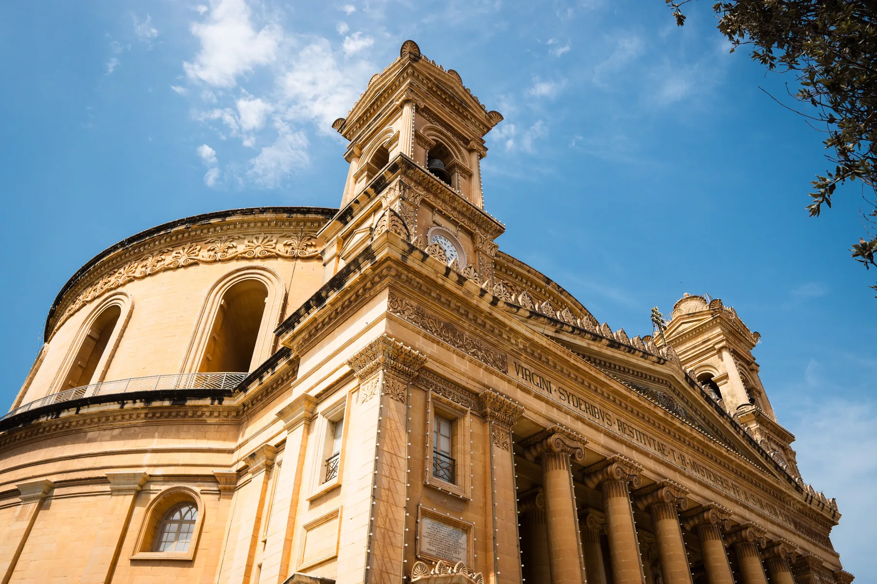 Exterior of the Rotunda of Mosta under a blue sky