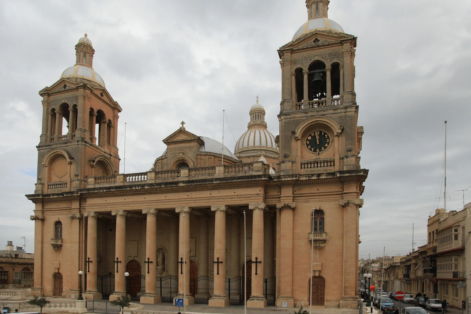Basilica of Christ the King, surrounding buildings and street edges in Paola, Malta
