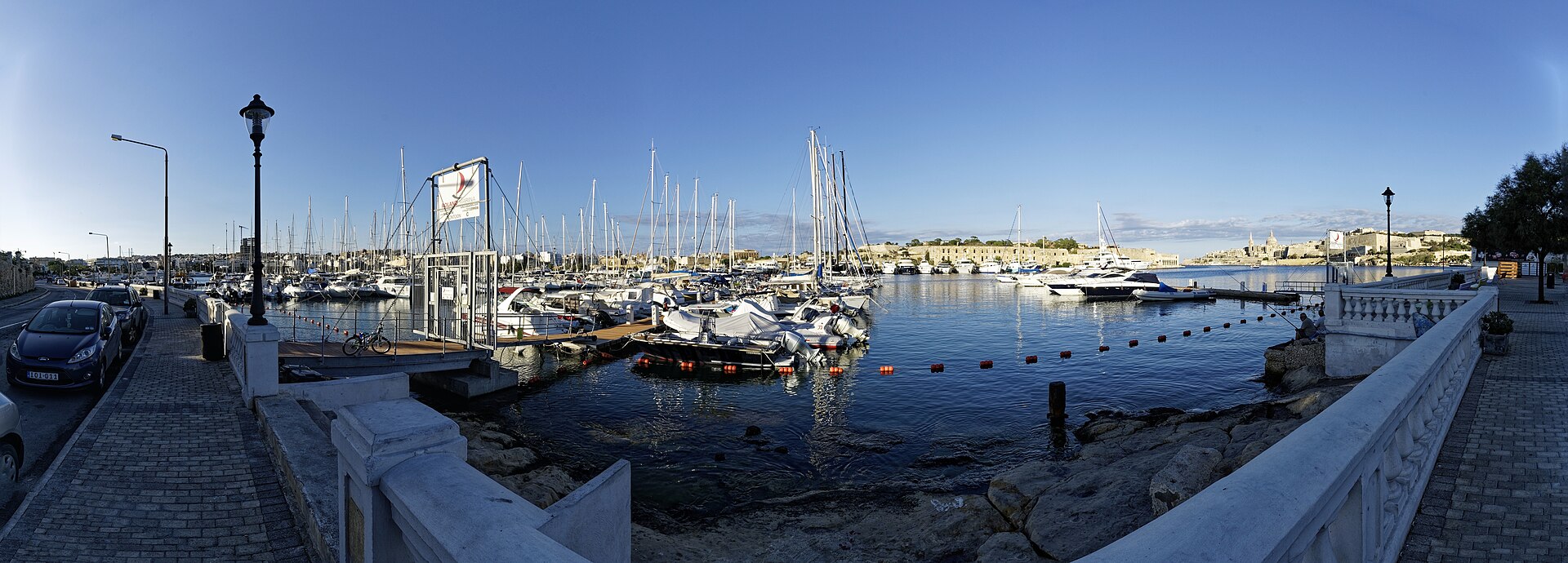 Ta’ Xbiex public waterfront and marina with Valletta across Marsamxett Harbour