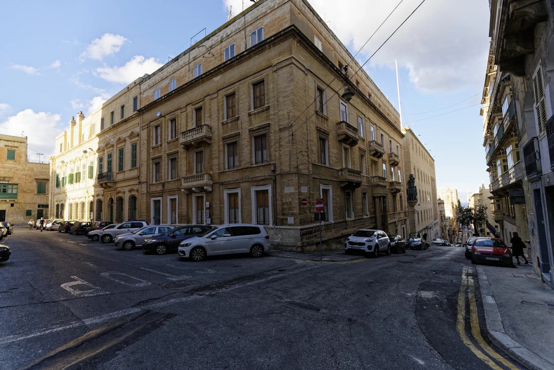 Sloping street junction and limestone façades in Valletta