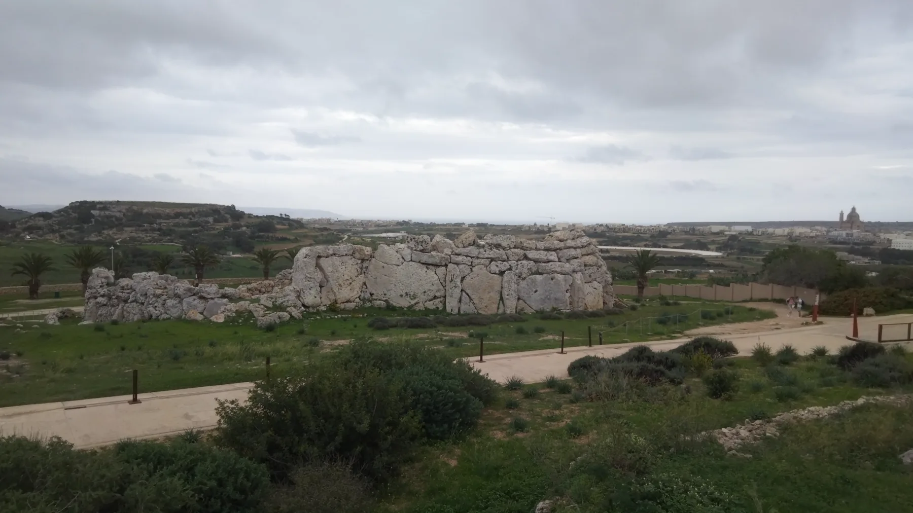 View across Ġgantija stone structures, fields and Xagħra on Gozo